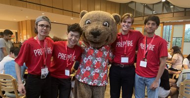 Prepare student mentors pose with Cornell Bear 